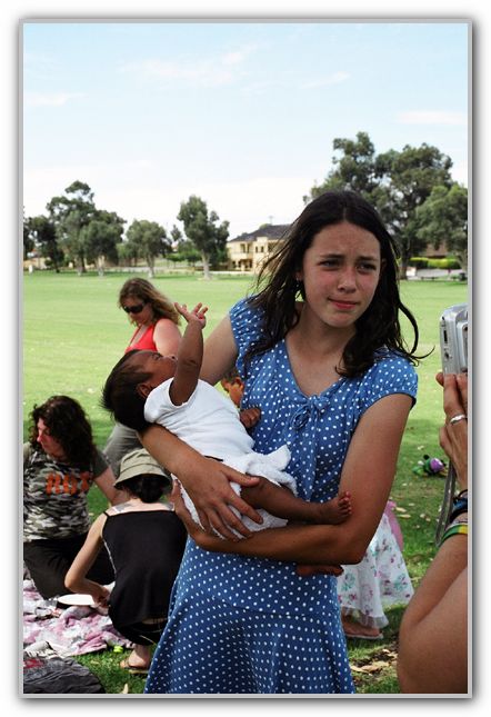 TK holding Ebonys Cousin at Ebonys Birthday Party
